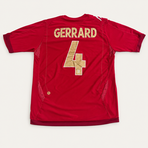 A red short-sleeve sports jersey shown flat against a light gray background, with 'GERRARD' and the number '4' in gold lettering on the back.